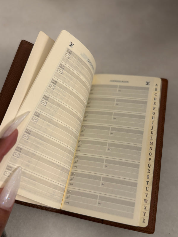 LV preowned address book with paper